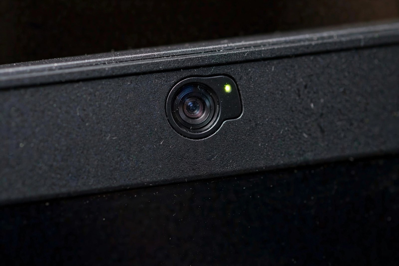 Close-up of a laptop webcam lens for checking windows 11 camera app not working physical blocks